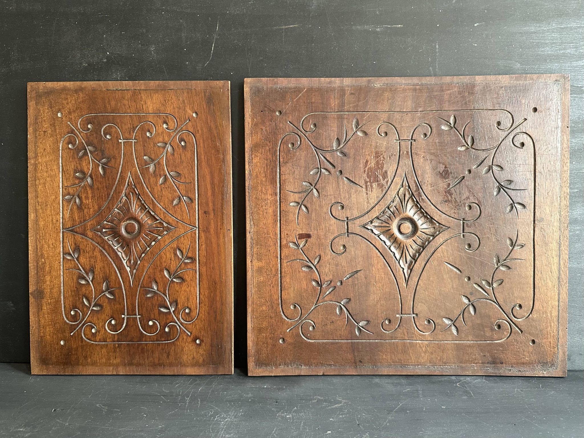 Pair of antique decorative panels in carved wood, late 19th century.