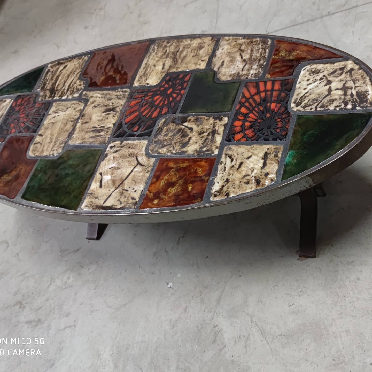Ceramic and steel elliptical table