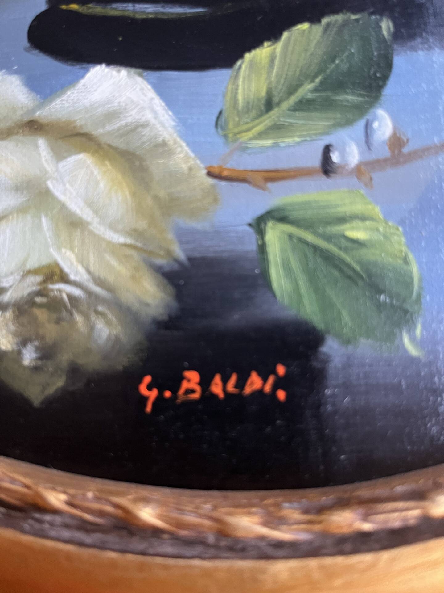 Large still life with white roses in an old gilded oval frame.