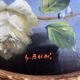 Large still life with white roses in an old gilded oval frame.