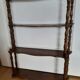 Turned wooden wall shelf
