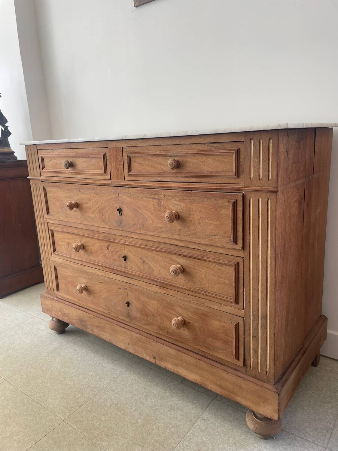 Sandblasted chest of drawers with white marble top