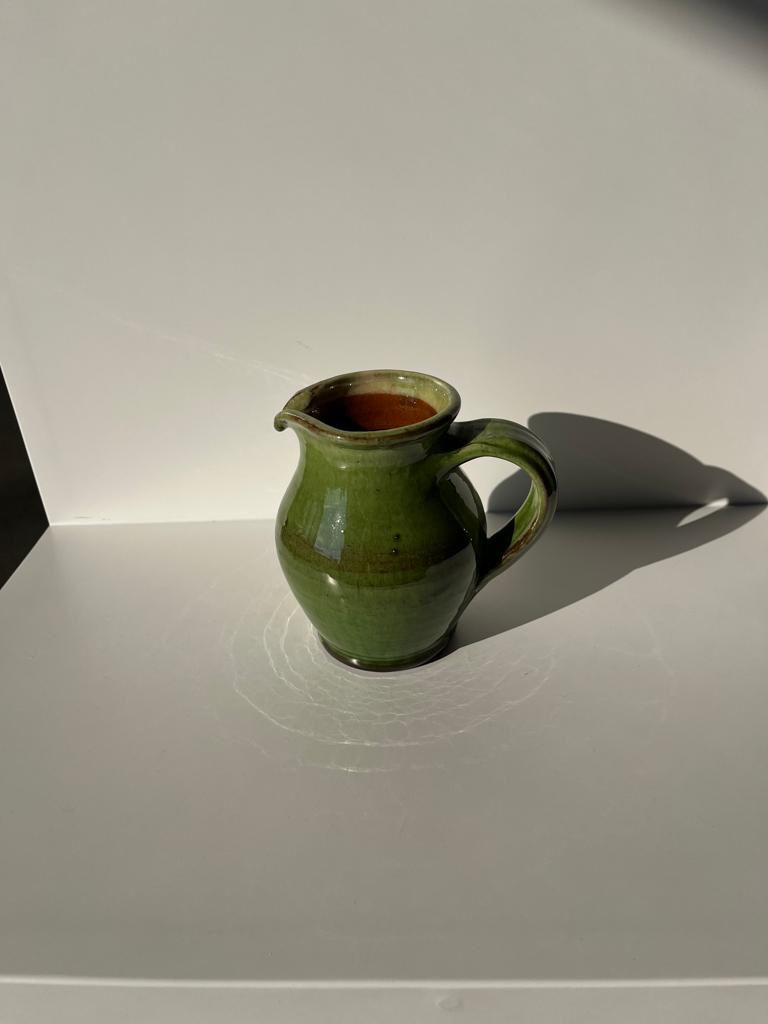 Green glazed ceramic pitcher