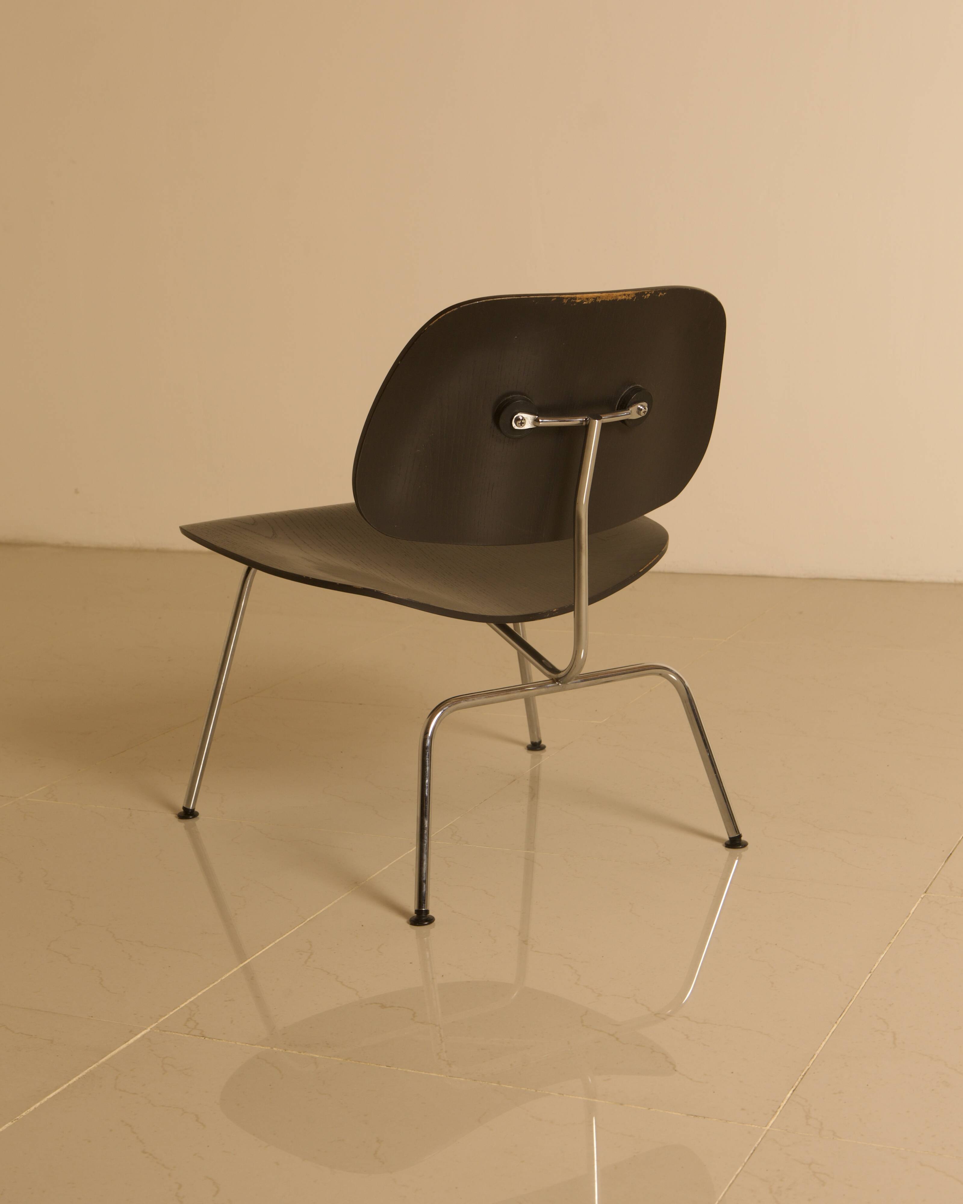 "LCM" chairs in black ash by Charles and Ray Eames for Herman Miller 60s.