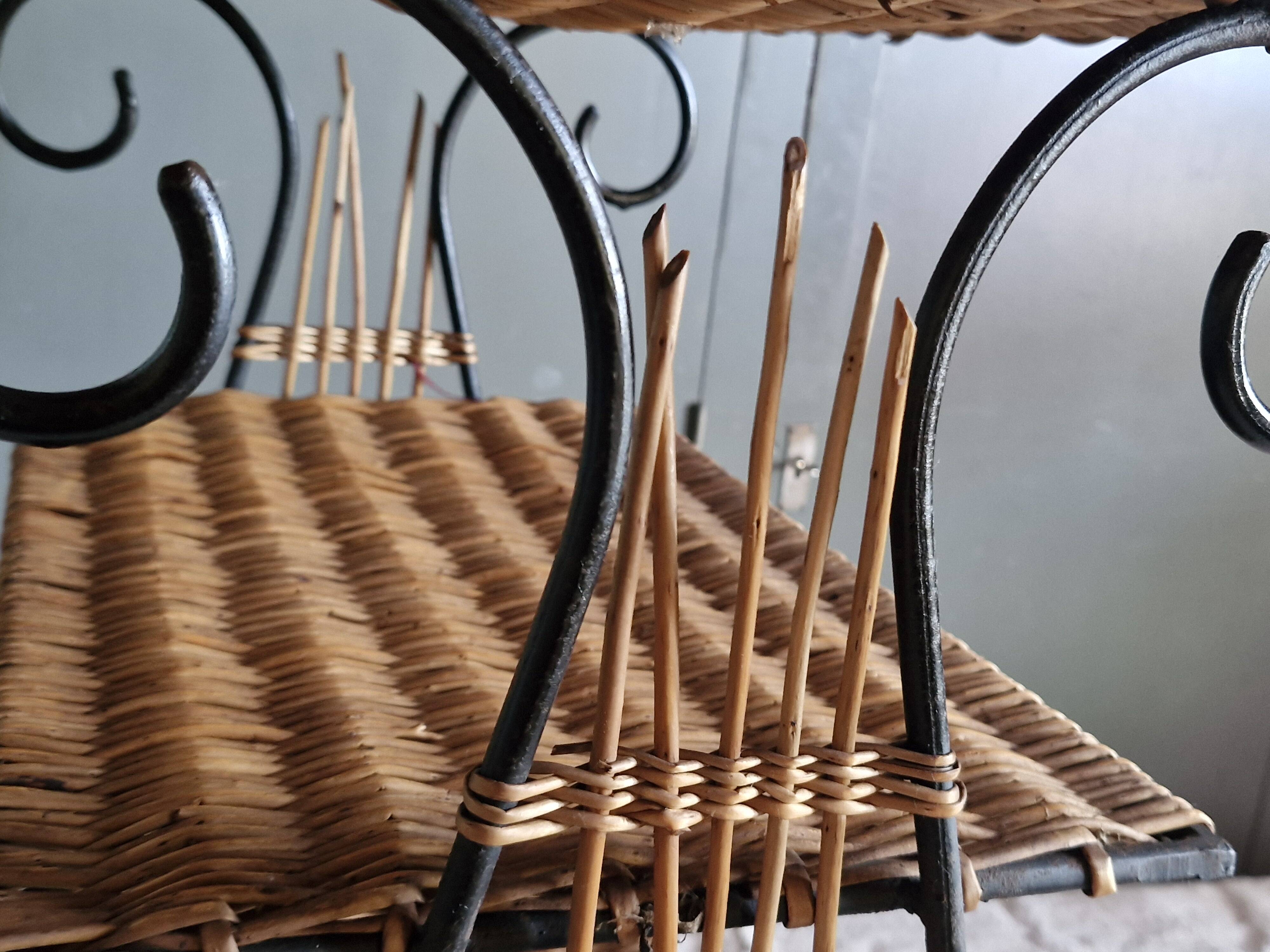 Small antique piece of furniture from the 1960s made of rattan and wrought iron in the shape of a lyre.