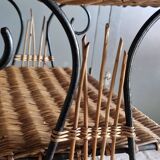 Small antique piece of furniture from the 1960s made of rattan and wrought iron in the shape of a lyre.