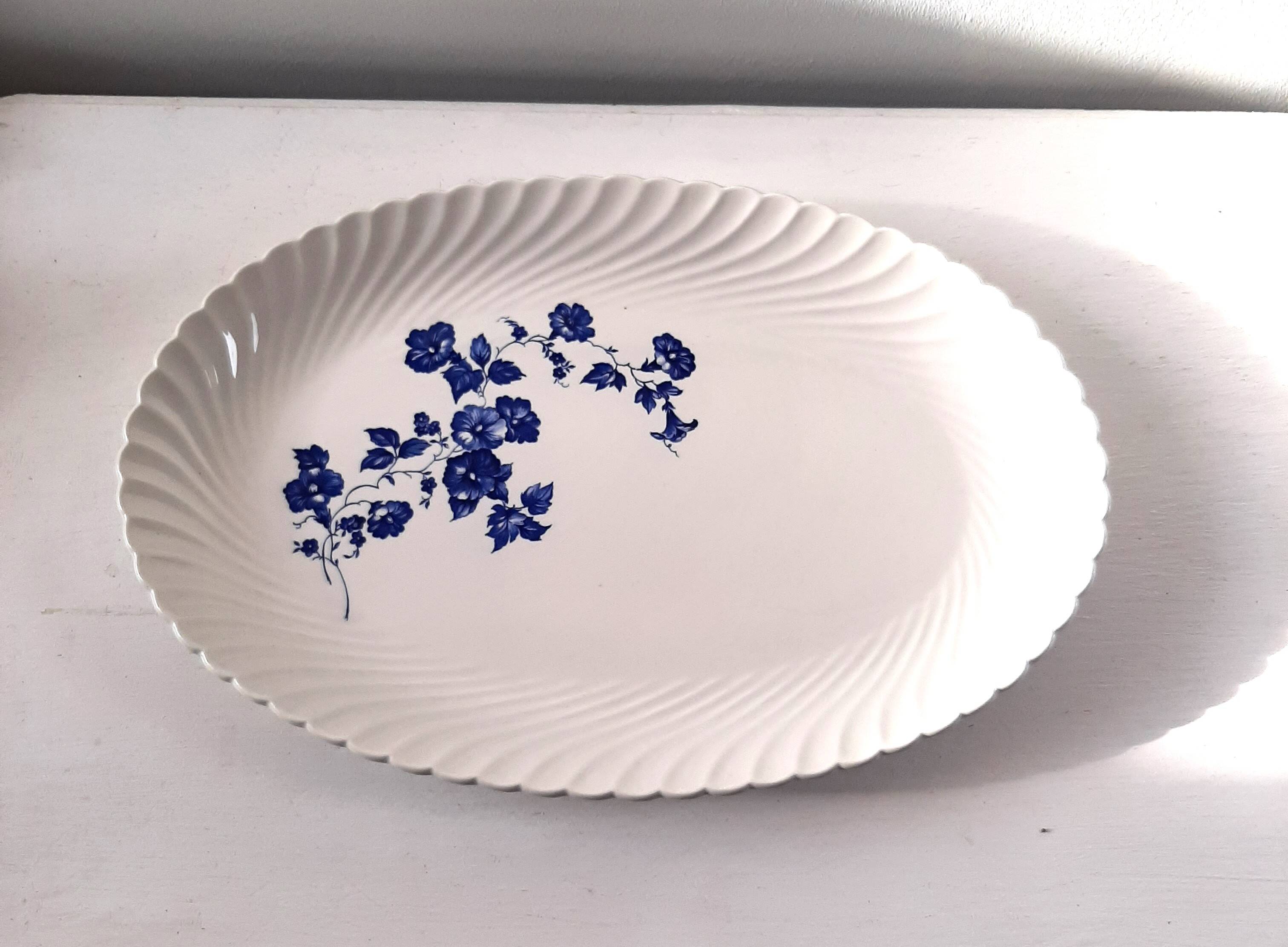 Keller and Guérin Lunéville serving dish with blue flowers on a white background.