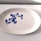 Keller and Guérin Lunéville serving dish with blue flowers on a white background.