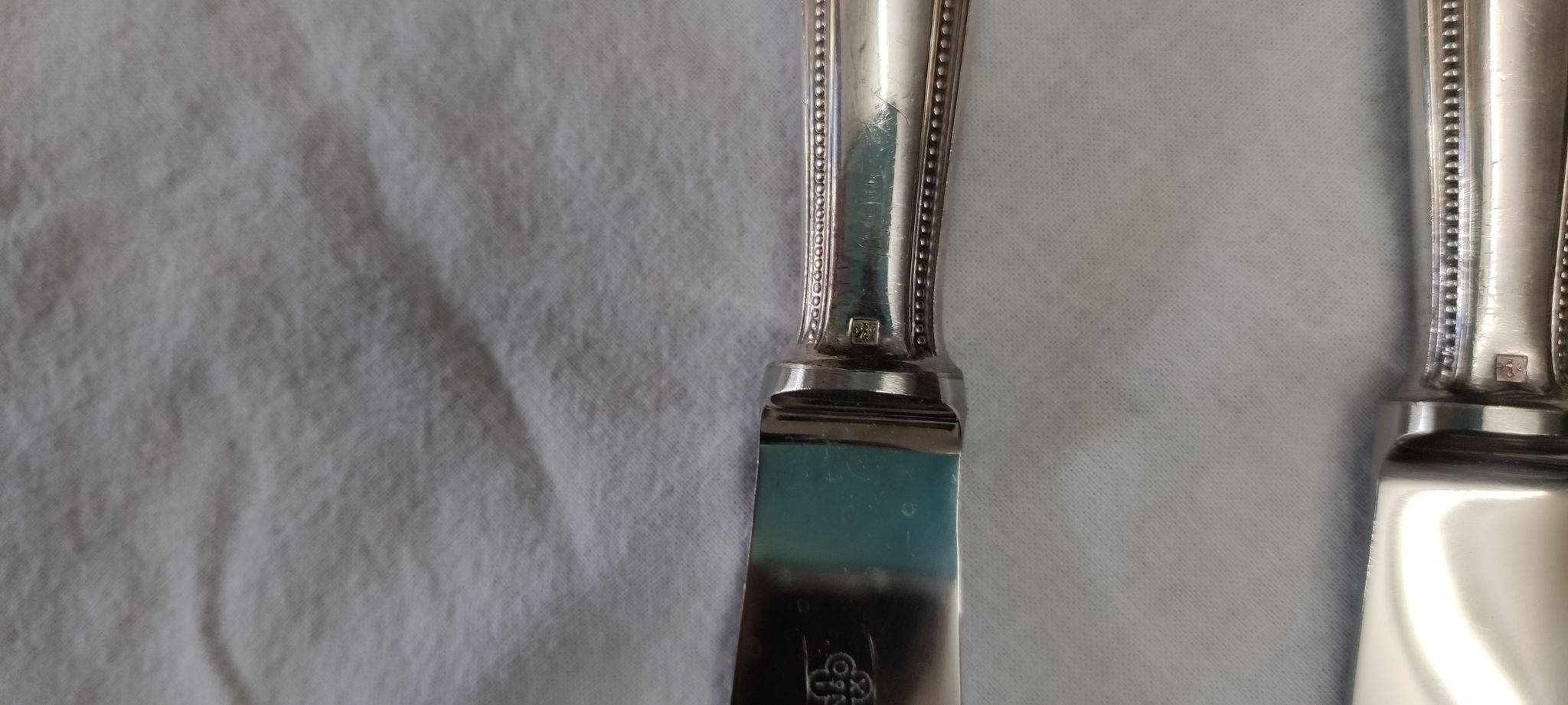 set of 12 Christofle table knives model "pearls" in silver metal from the 60s