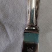 set of 12 Christofle table knives model "pearls" in silver metal from the 60s