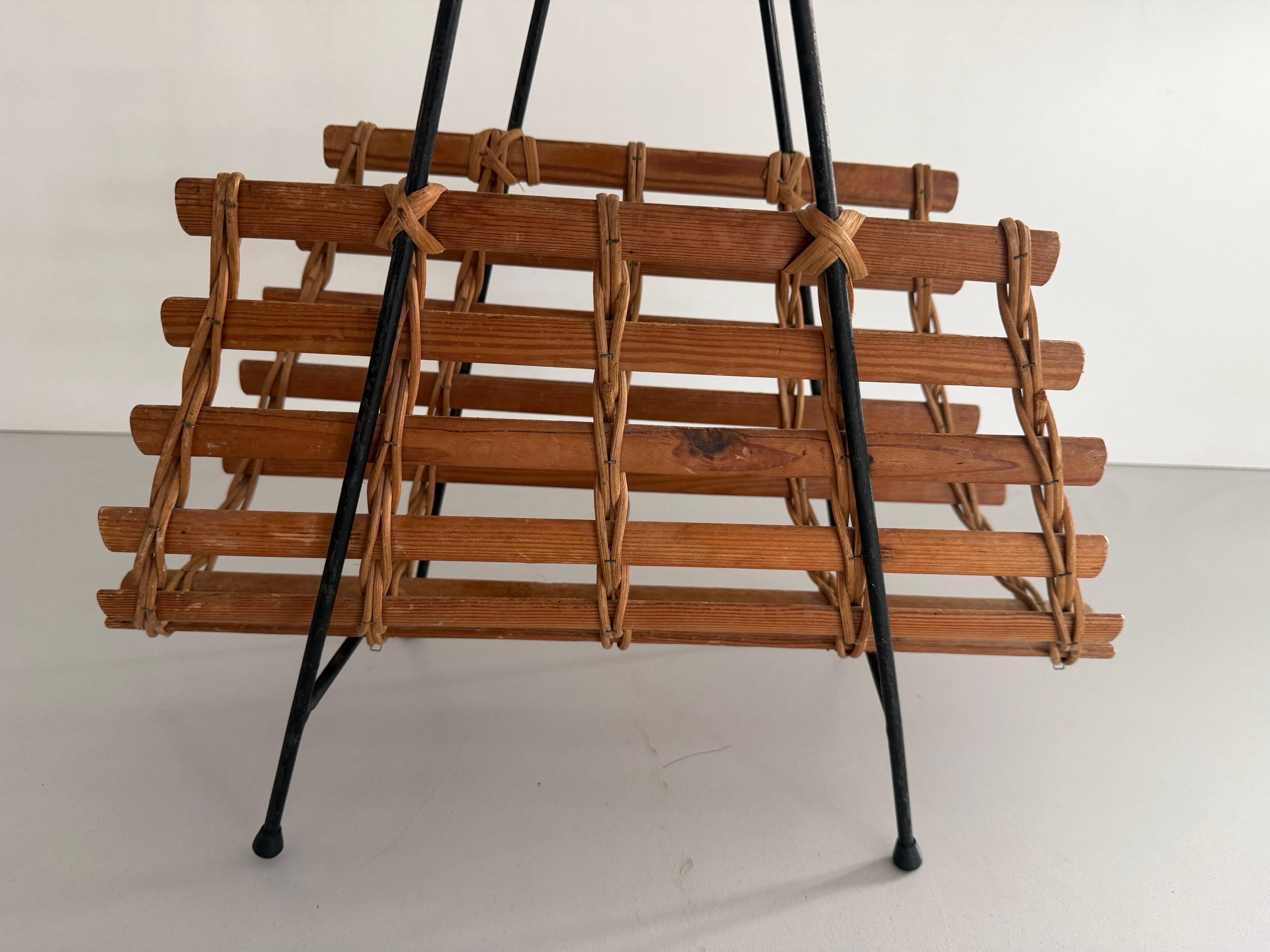Mid-century black metal and wicker magazine rack, 1960, Germany
