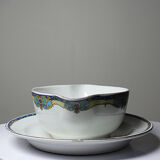 Old Lunéville sauce boat, opaque porcelain with polychrome decoration.