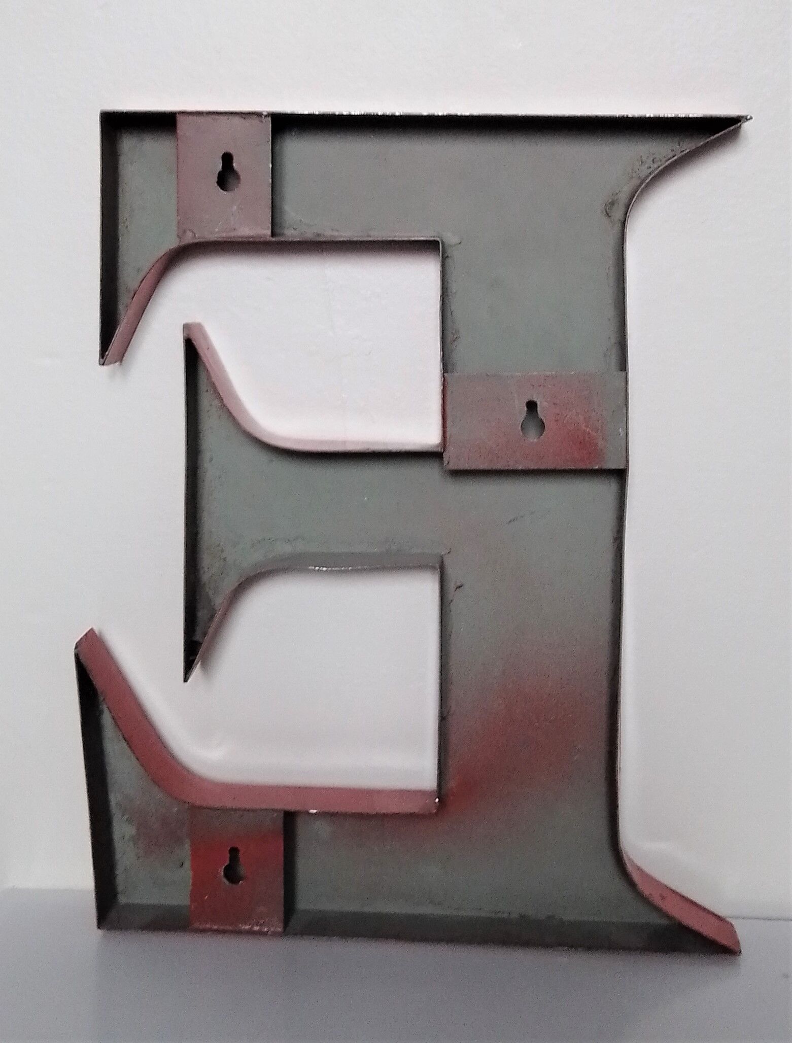 Red metal sign letter "E"