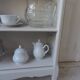 Small bookcase, 2 adjustable pearl gray patinated shelves, wooden top