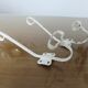 Pair of white metal hooks 30s 40s