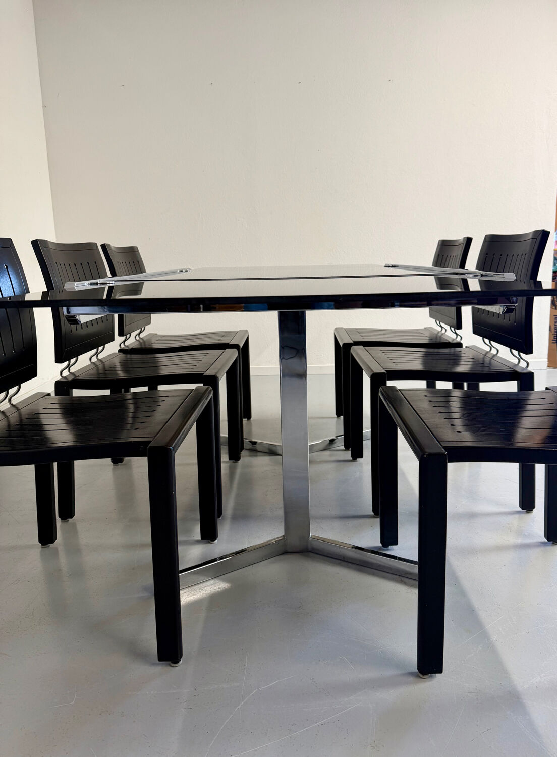 Smoked glass dining table with chrome legs, 1970s design by Roche Bobois.