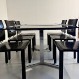 Smoked glass dining table with chrome legs, 1970s design by Roche Bobois.