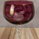 Antique fuchsia pink engraved glass – twisted stem