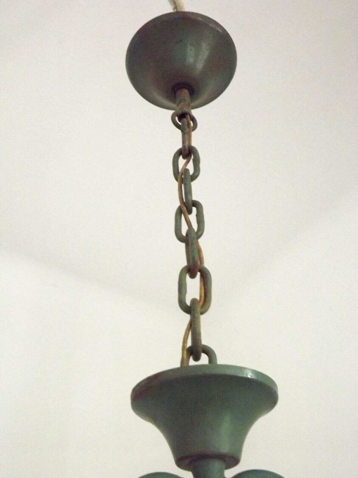 Green iron 4 light chandelier with scrolled arms