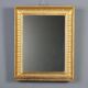 Antique Empire mirror in gilded wood, Italy, 19th century.