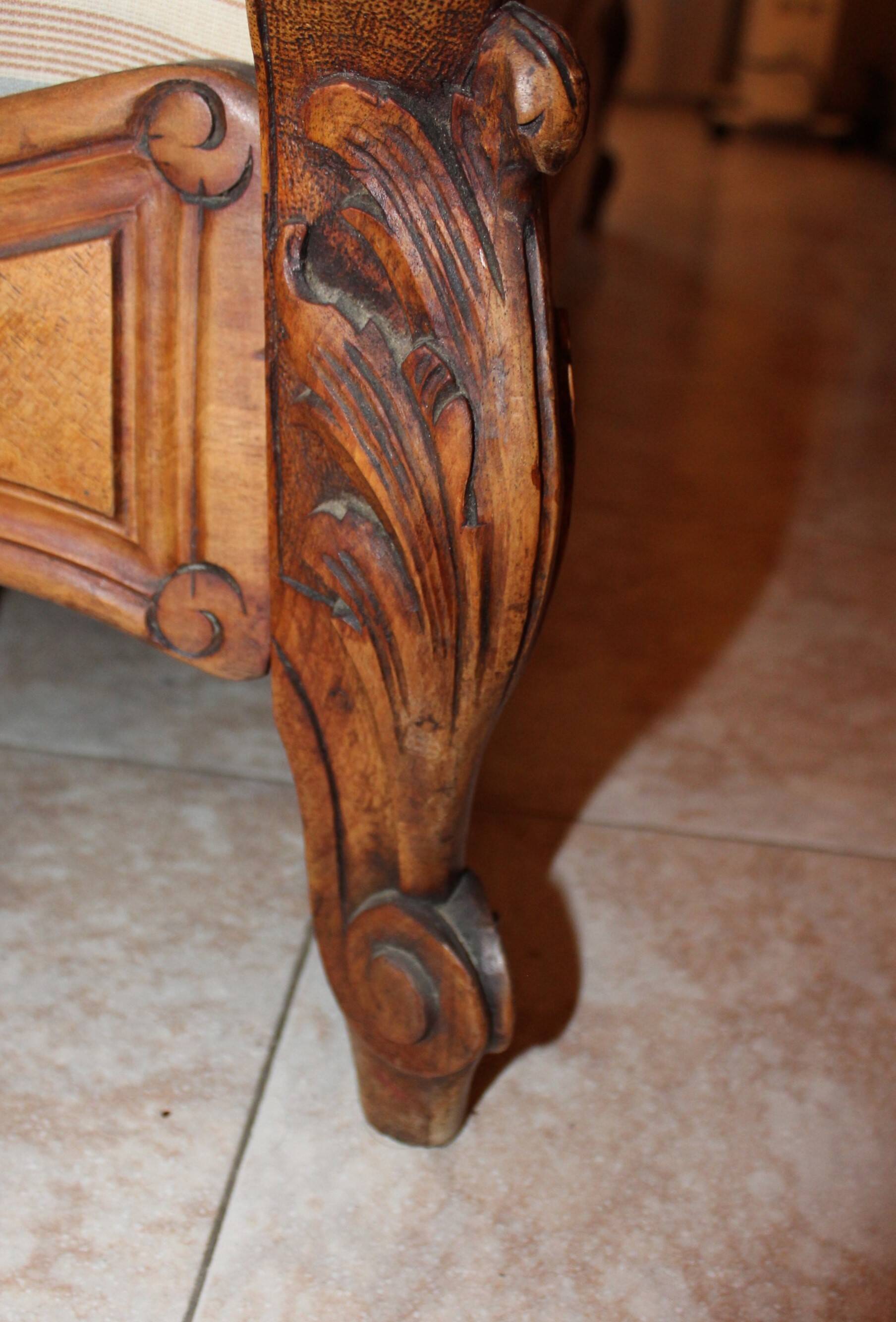 Walnut rocaille bed from the early 20th century.