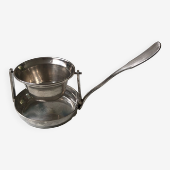 Silver rocking tea strainer