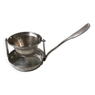 Silver rocking tea strainer