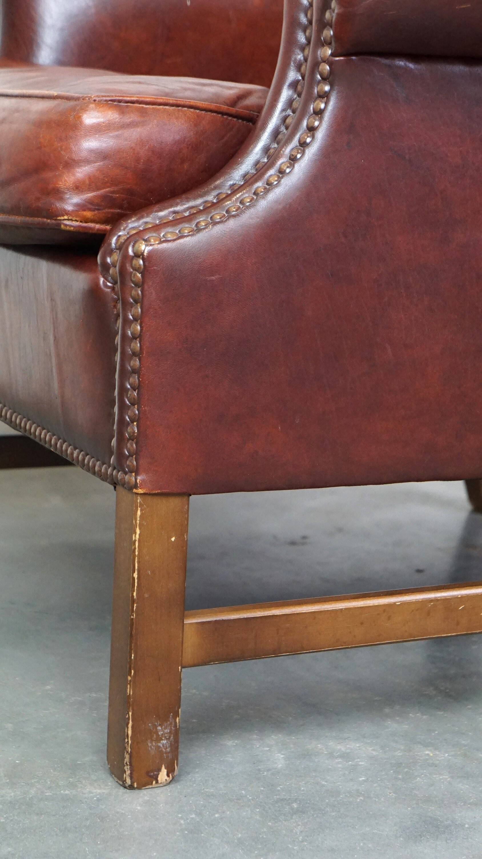 Large comfortable sheepleather wingchair in good condition and beautiful colours