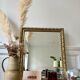 Bevelled mirror in carved gilded wood