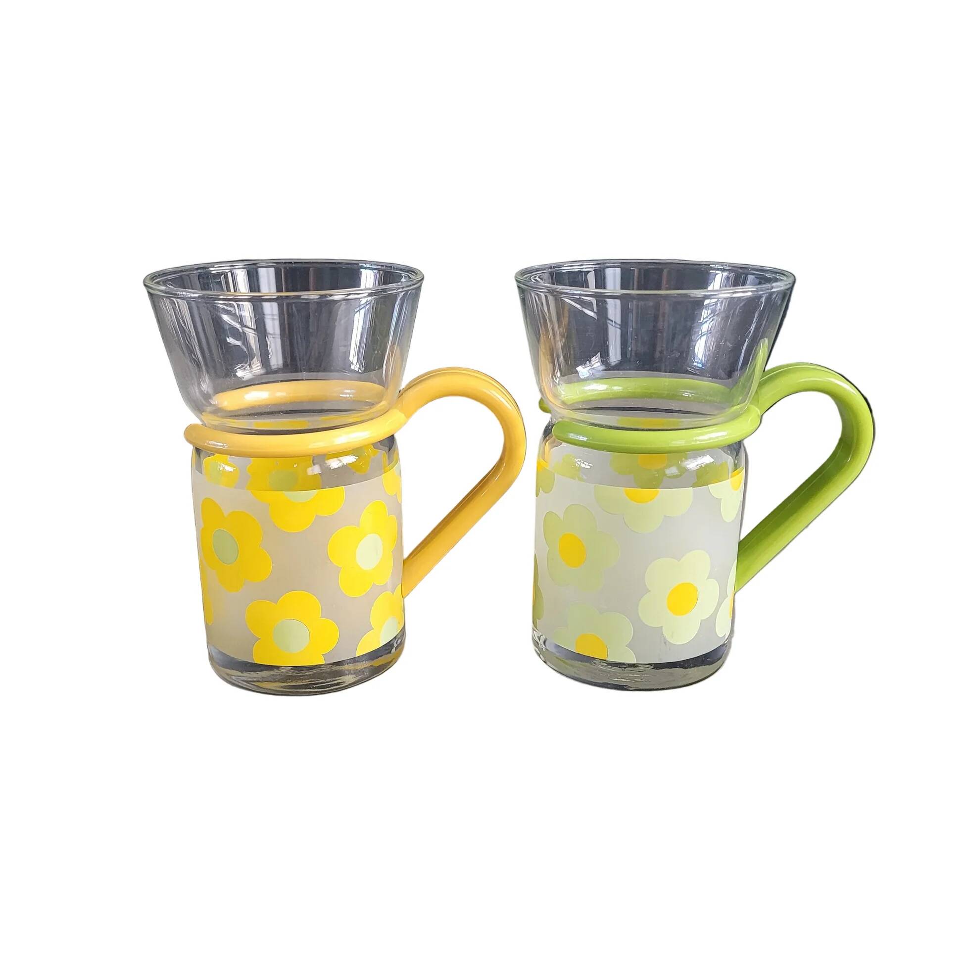 Pair of glass teacups with plastic handles