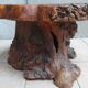 Brutalist chessboard coffee table made from tree stump.