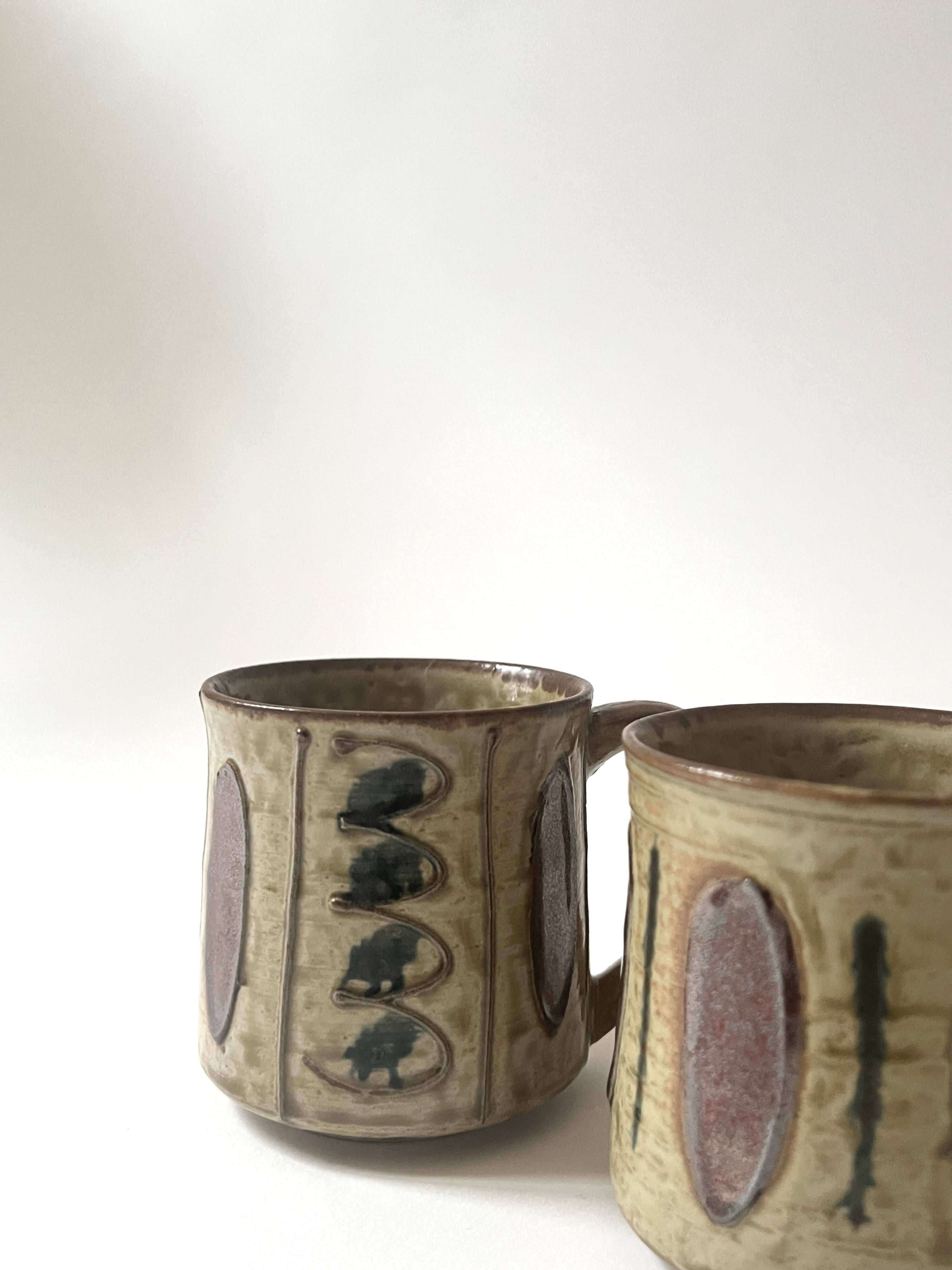 Set of 2 glazed ceramic coffee mugs from around 1970.