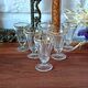 Antique footed liqueur glasses with gold trim from the early 20th century.