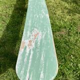Old curved wooden farm bench