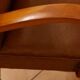 Pair of Art Deco armchairs in curved wood and brown leather – 1930s