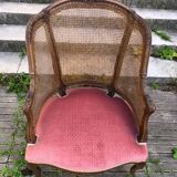 Louis XV style walnut and cane armchair