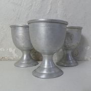 3 old aluminum shells