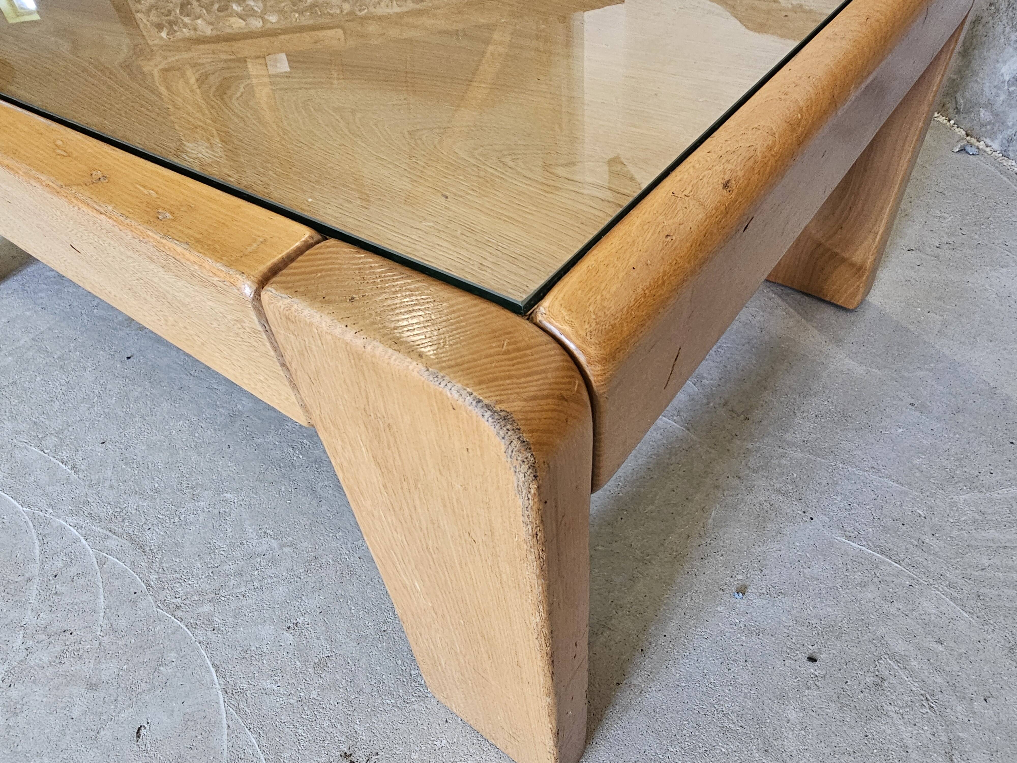 Designer coffee table 1970-1980 in kois elm and glass