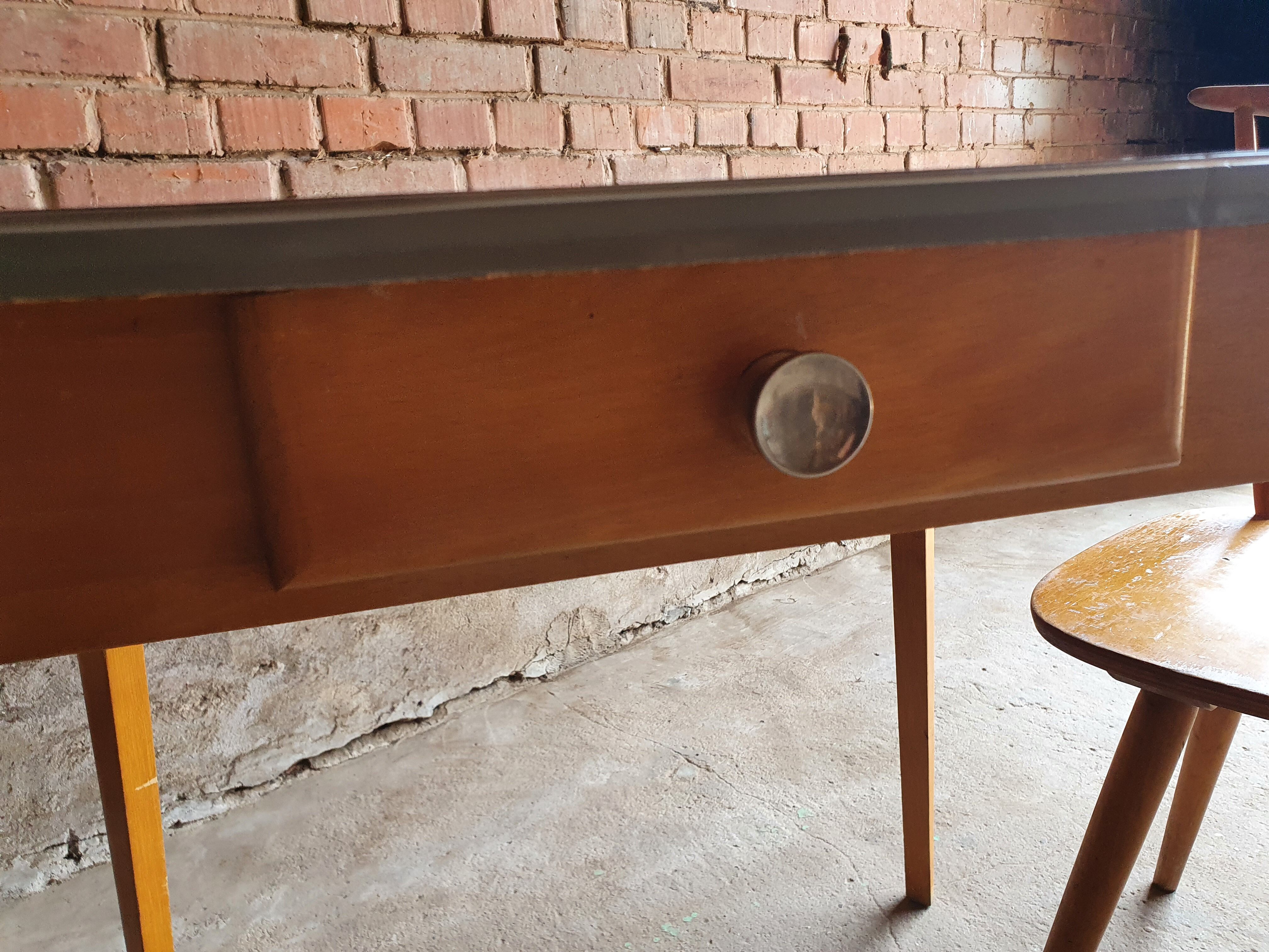 Together two Scandinavian chairs and its wooden and formica table