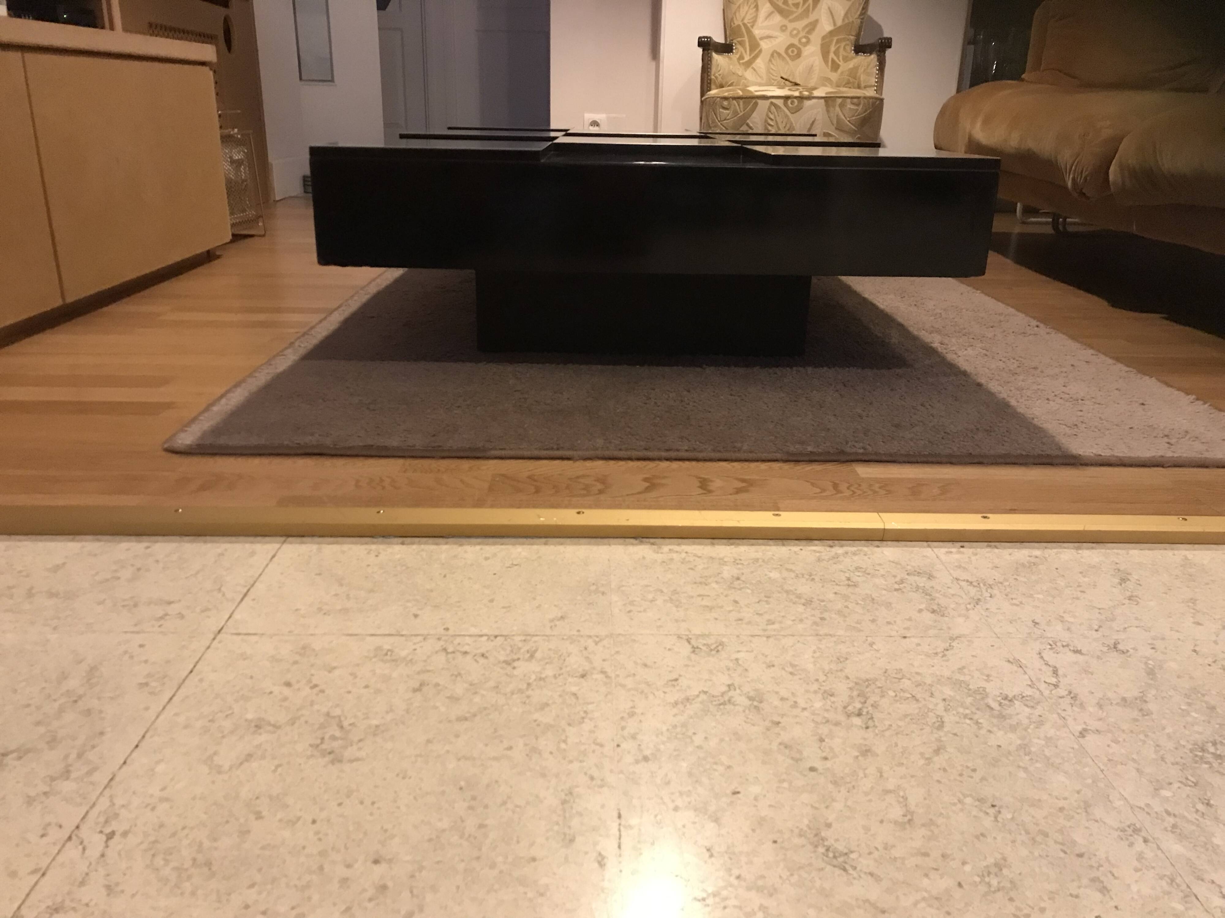 Coffee table with stainless steel checkered top and black formica