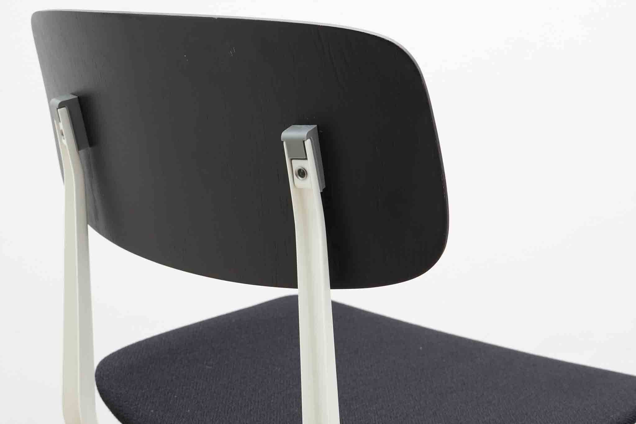 Friso Kramer "Result" chair upholstered in black and white.