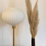 Table lamp with a white striped globe, origami style and a golden foot