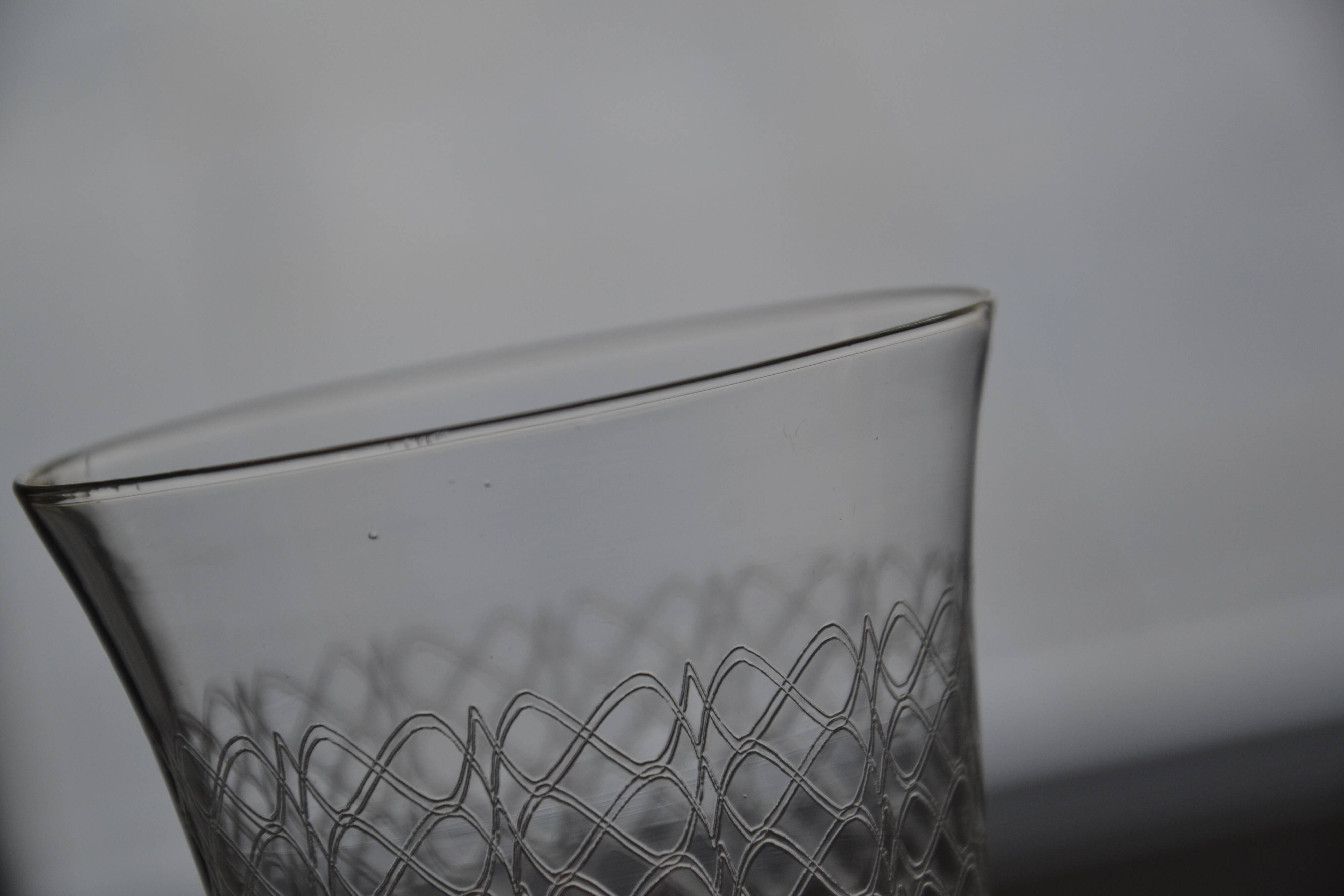 12 wine/water glasses engraved with Art Nouveau garland.