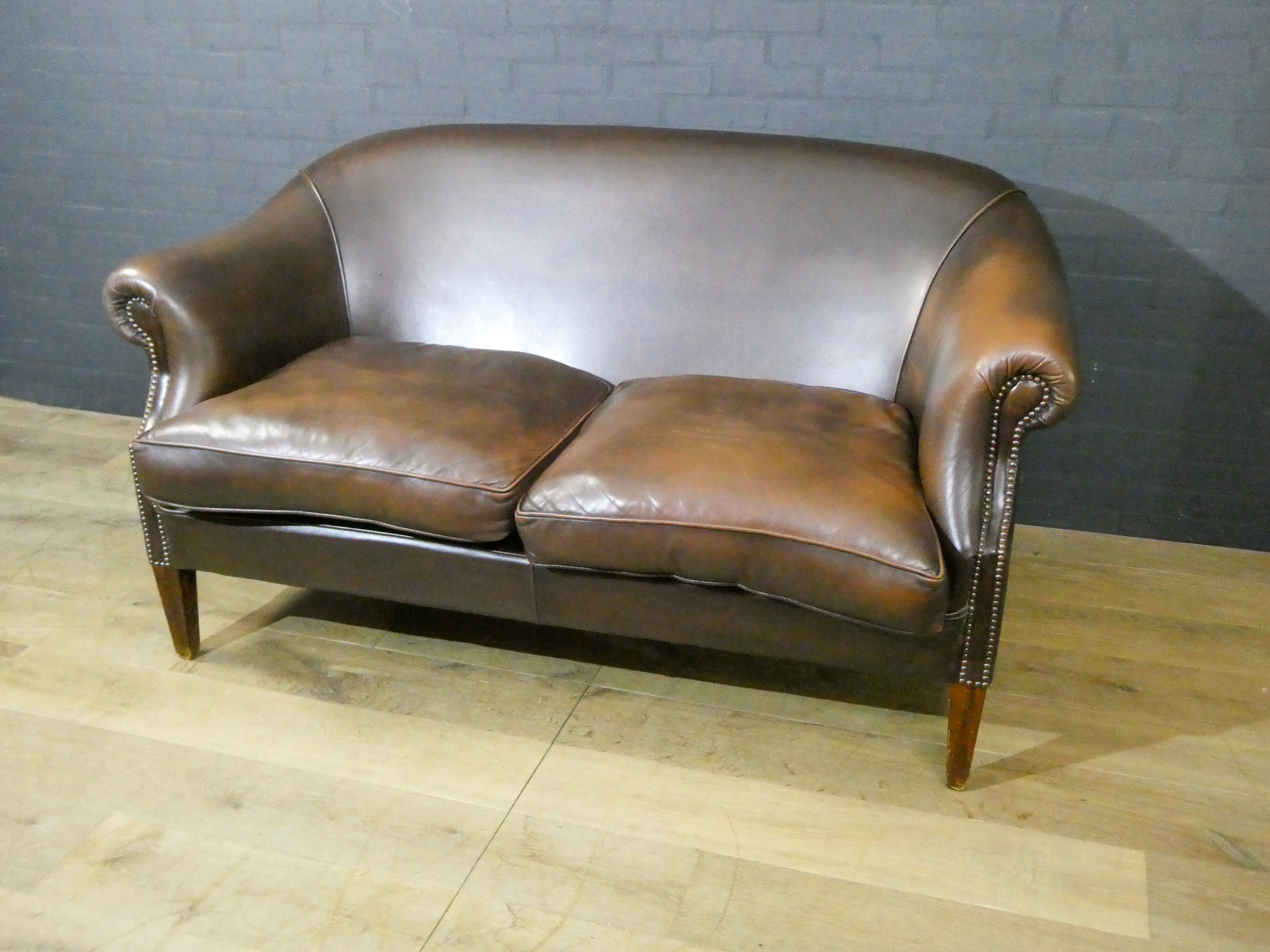 Vintage leather 2-seater sofa in dark brown
