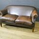 Vintage leather 2-seater sofa in dark brown