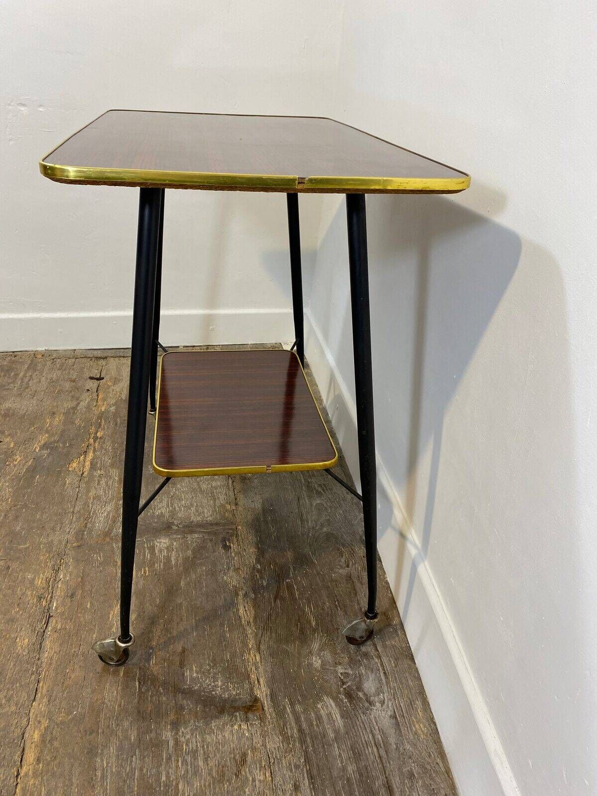 Vintage side table, brass gallery and wheels, 1950s.