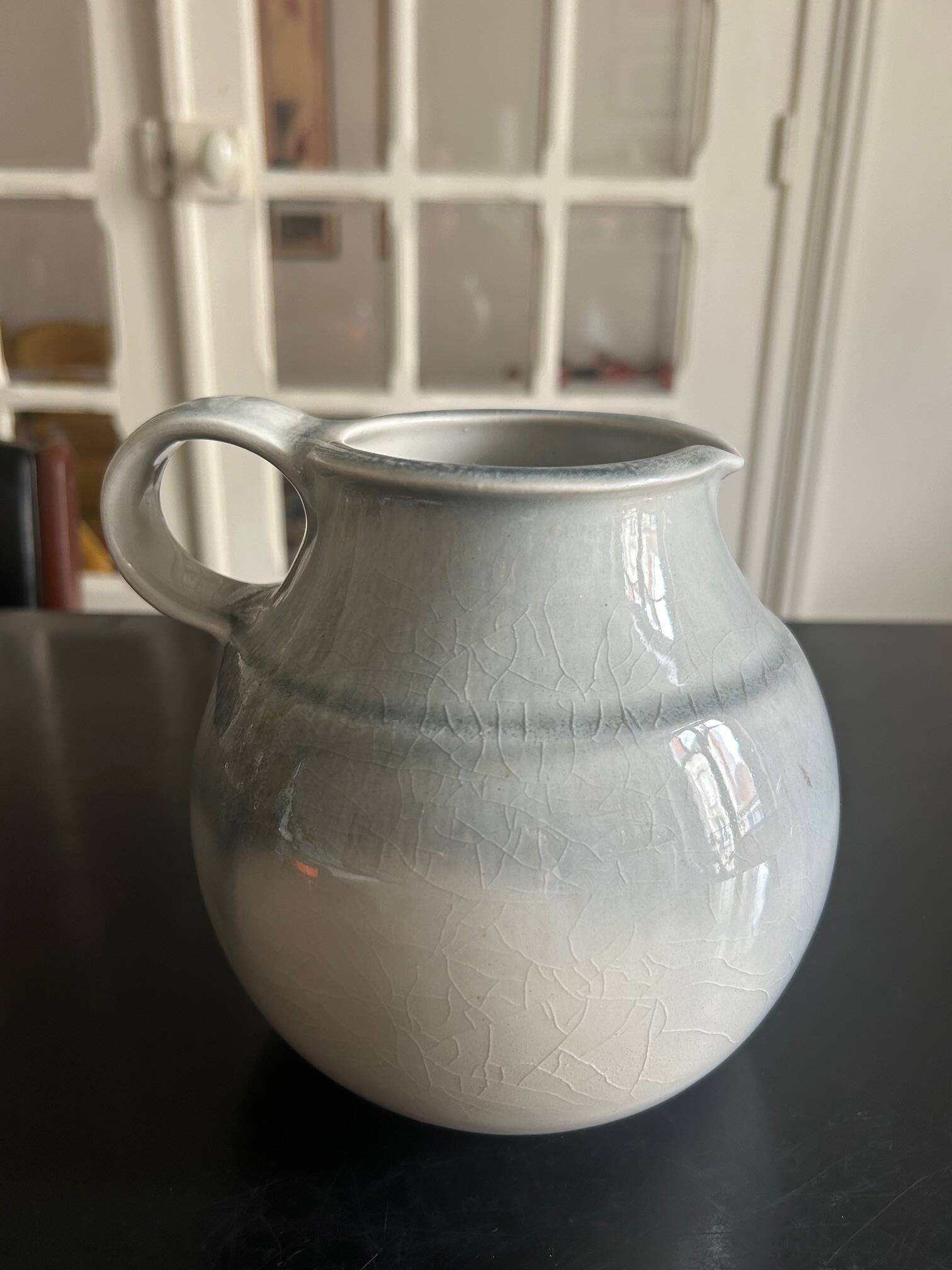 large blue ceramic pitcher