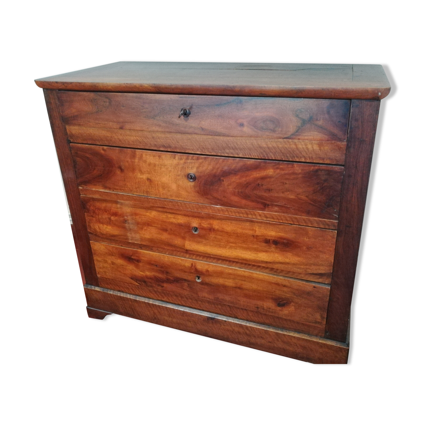 Molded walnut chest of drawers