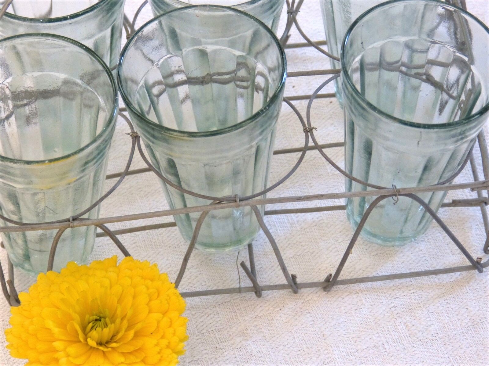 Together with 6 glasses wire basket