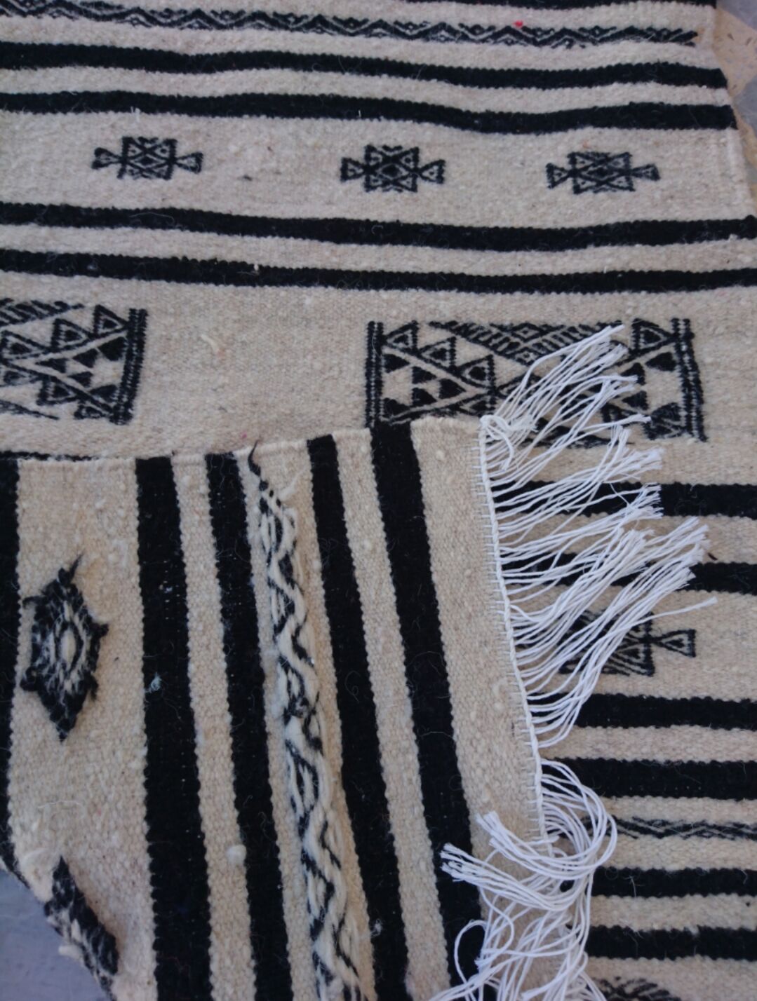 Beige and black handmade carpet, 110x55cm